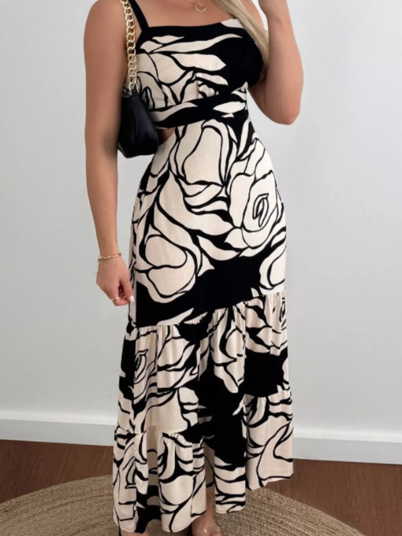 black and cream floral maxi cutout back cami dress with slim straps and tiered skirt