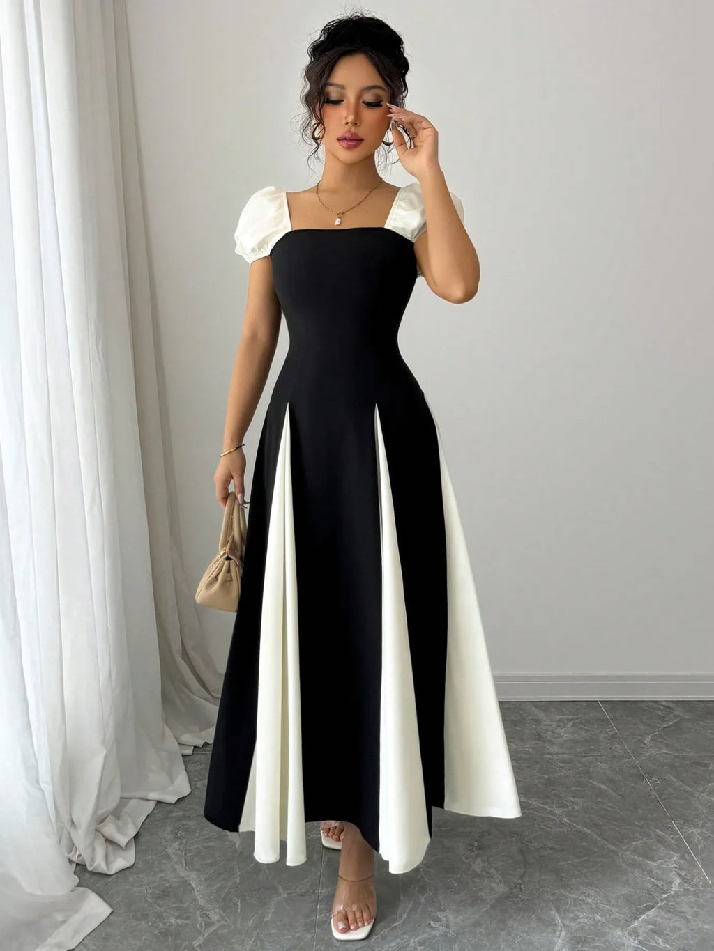contrast puff sleeve midi dress in black with white puff sleeves and white skirt panels square neckline