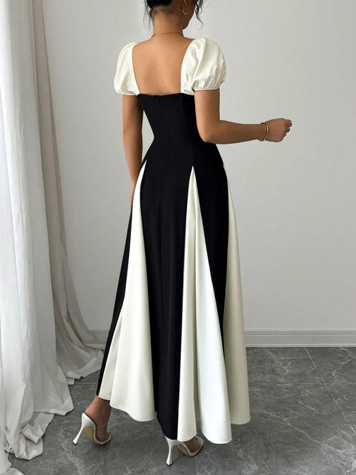 contrast puff sleeve midi dress back view black fitted bodice with white puff sleeves and flared panels