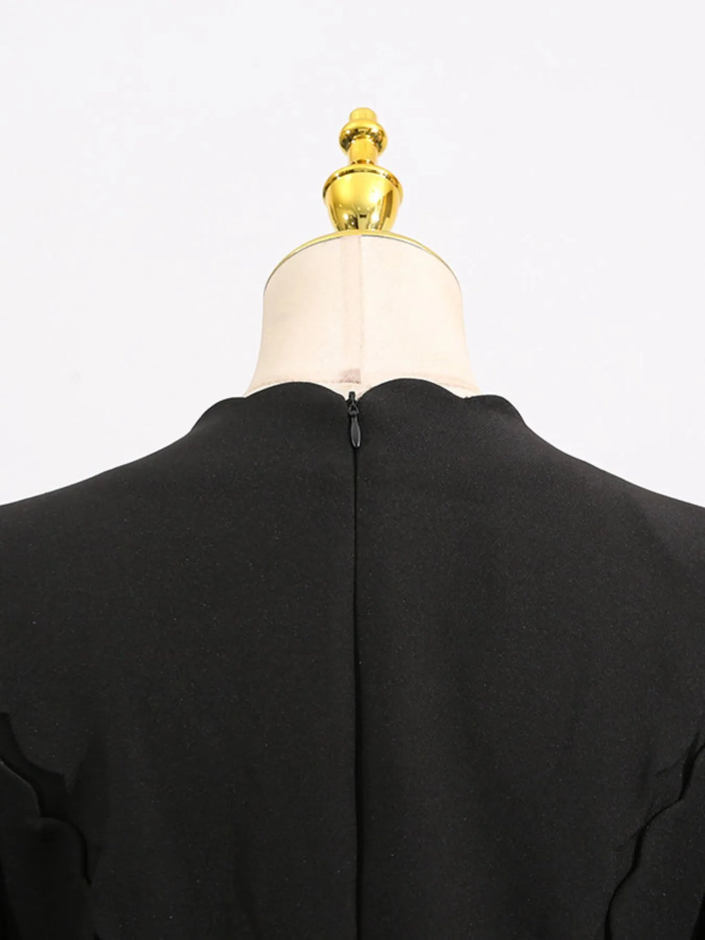 long sleeve bow front midi dress shown from back on mannequin with center back zipper and scalloped neckline