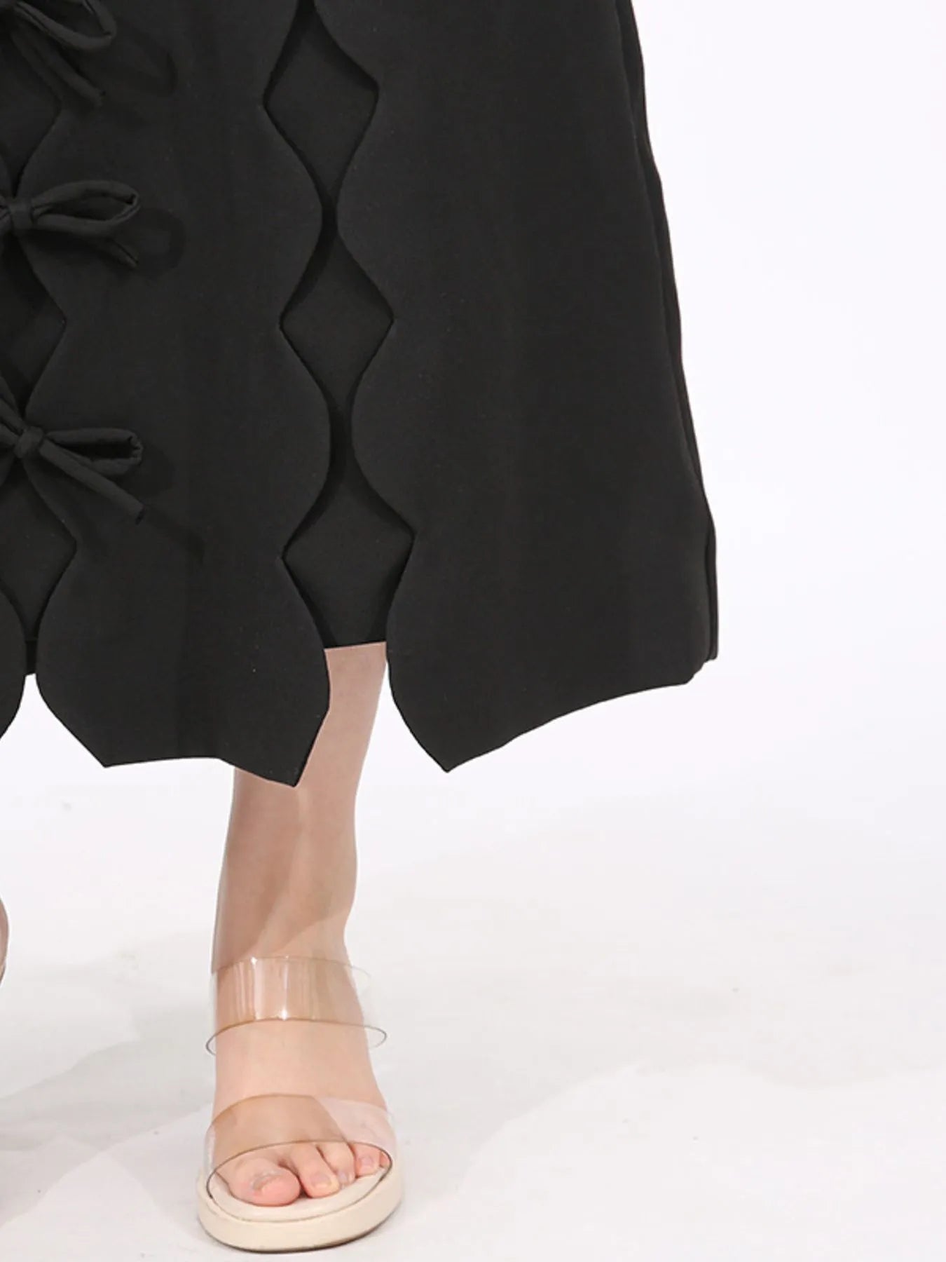 long sleeve bow front midi dress black scalloped side cutouts with bows shown with clear strap sandals