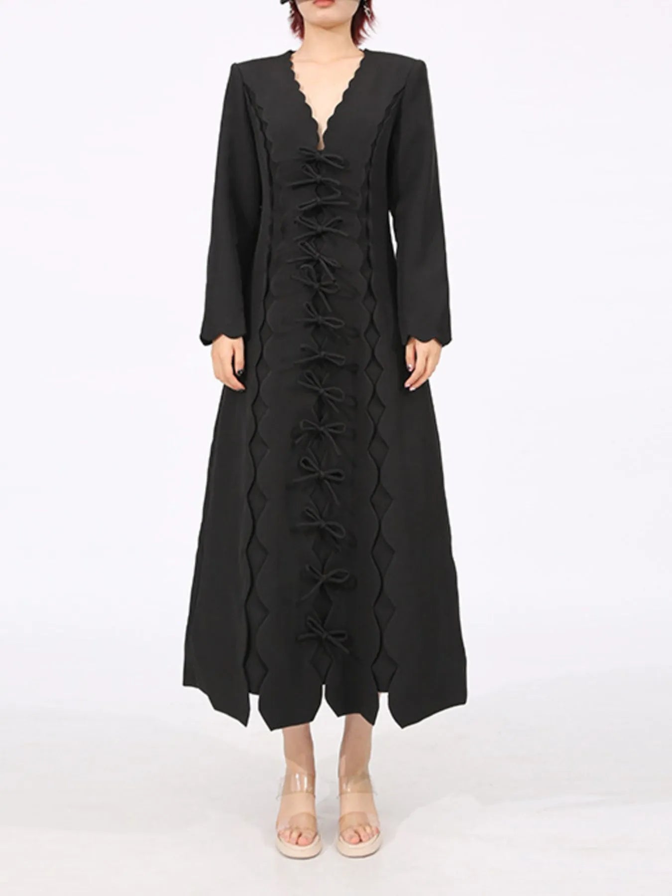black long sleeve bow front midi dress with scalloped V neck and center bow detailing