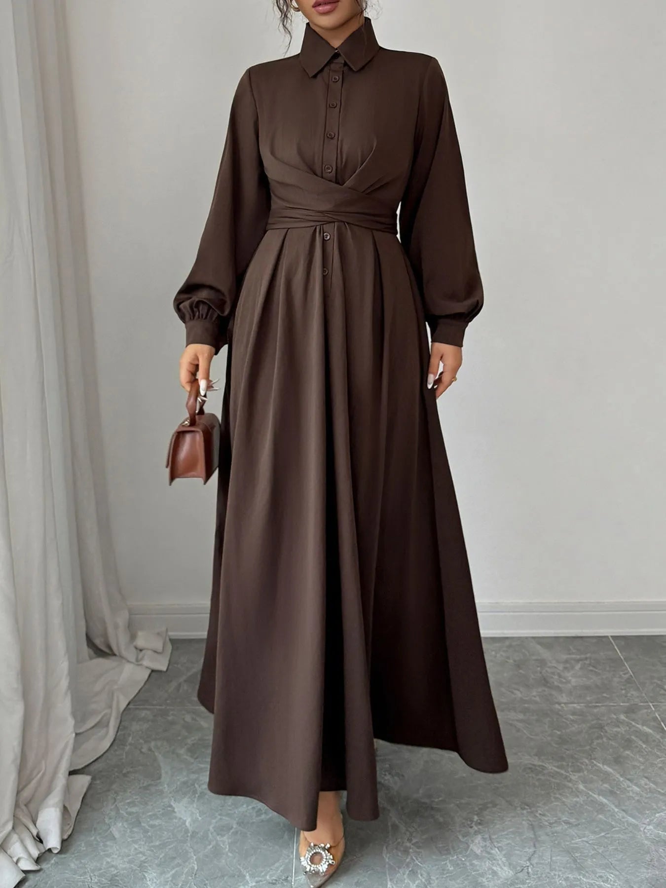 brown long sleeve maxi shirt dress with collared bodice wrap waist detail balloon sleeves and small handbag
