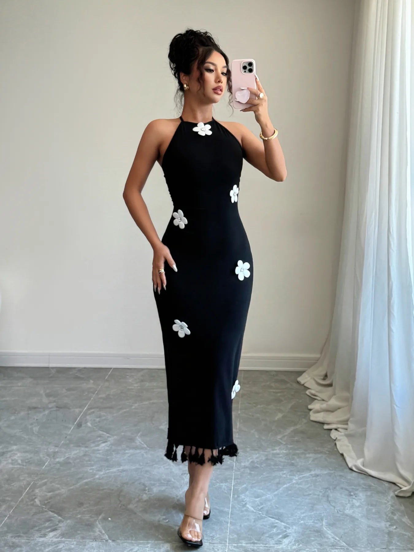 black midi flower halter neck dress with white appliqued flowers fitted silhouette fringe hem