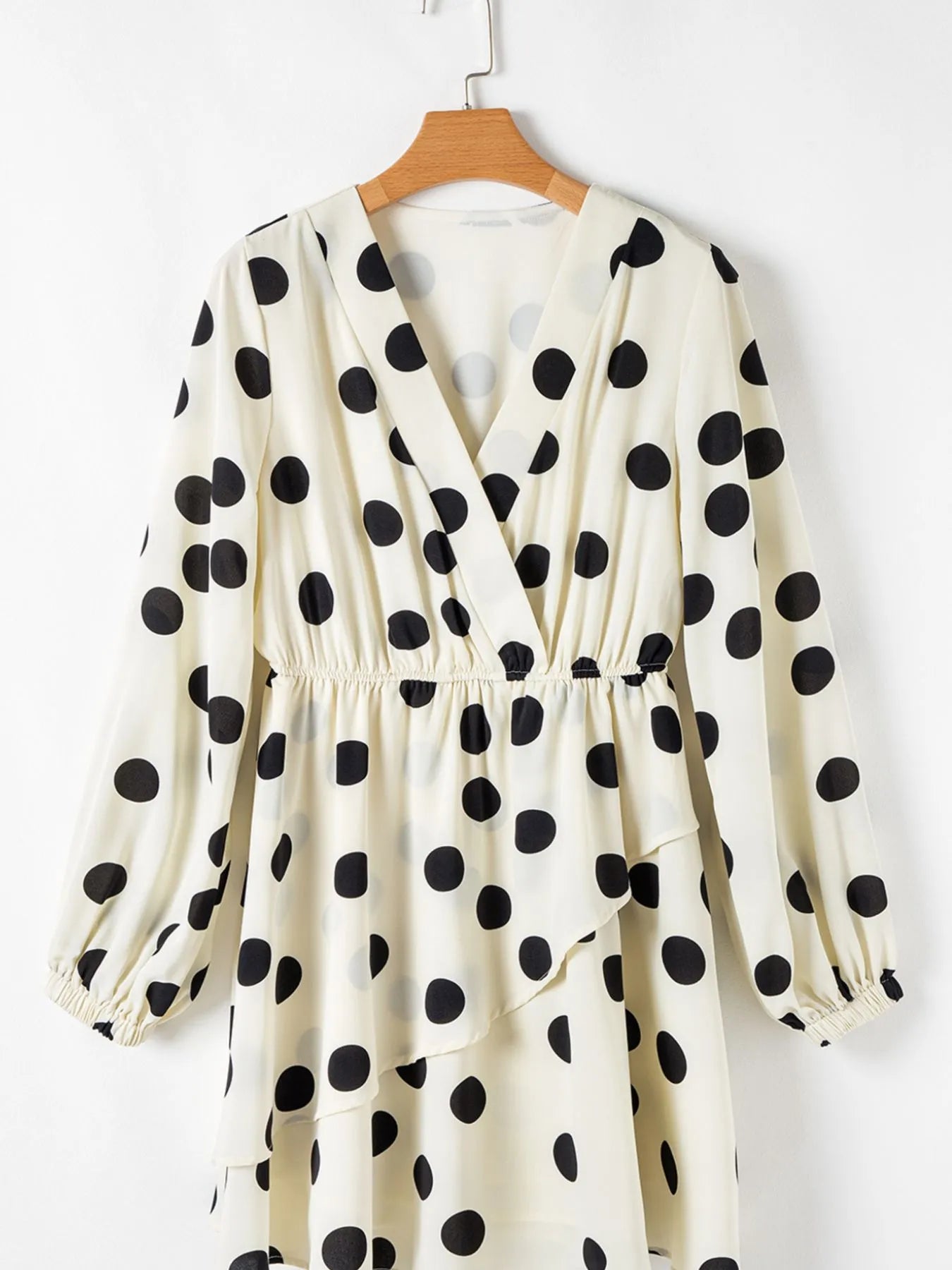 cream wrap polka dot mini dress with black large dots long sleeves elastic waist V neck ruffle tiered hem