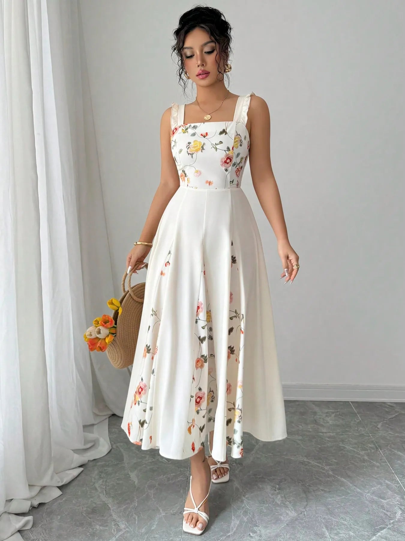 printed square neck midi dress white floral A line tea length with straps model holding straw bag
