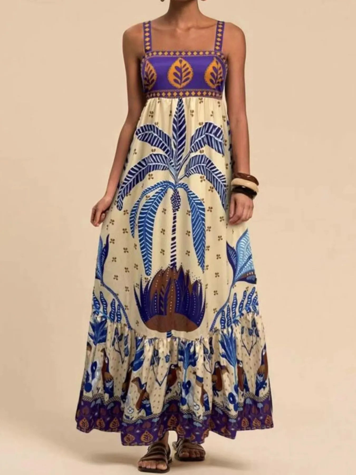 tropical print maxi dress with blue palm motif smocked bodice and flowing tiered skirt