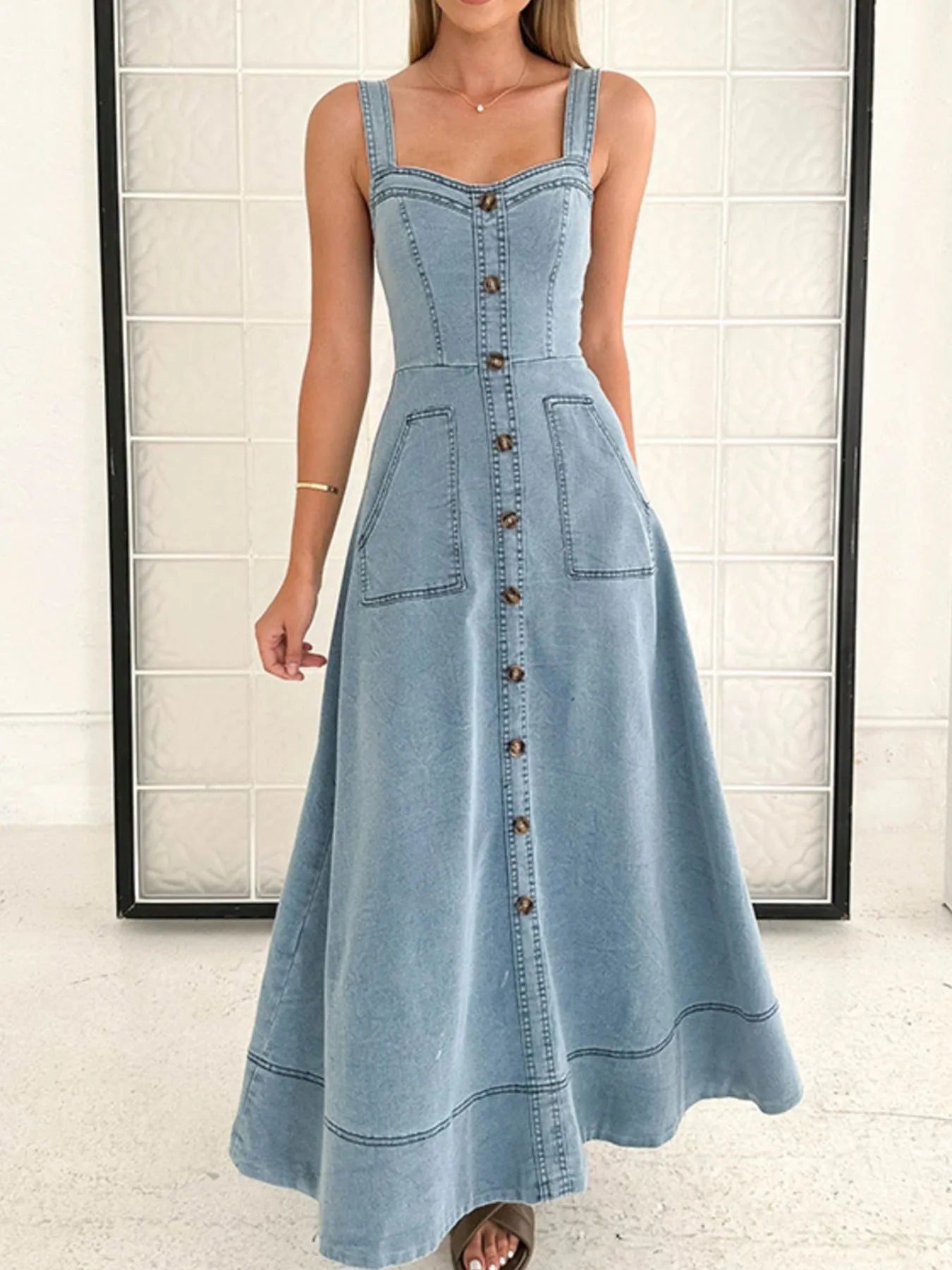 wide strap denim dress with button front fitted bodice and A line maxi skirt