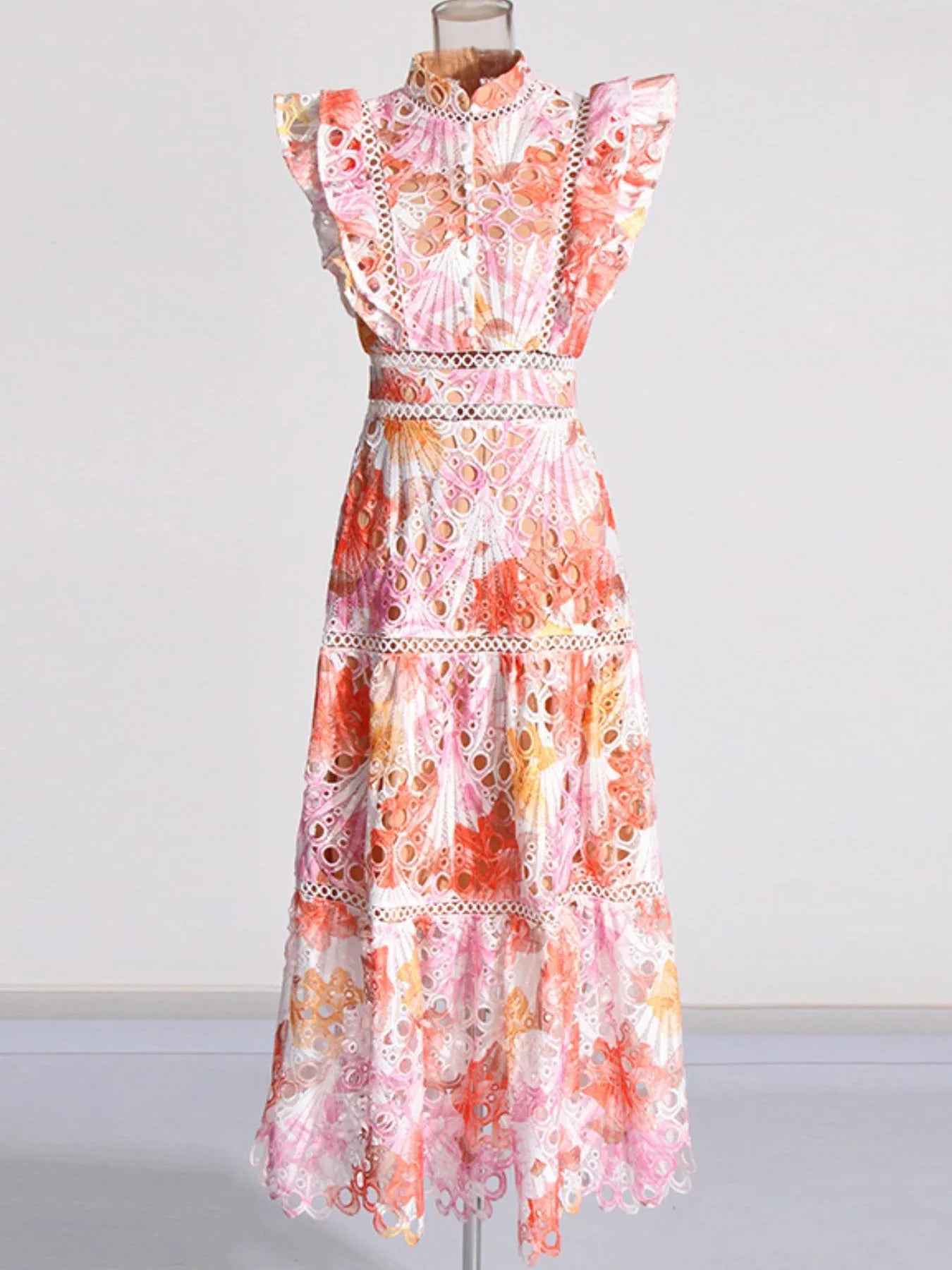 Pastel floral lace high neck dress on mannequin with flutter sleeves and tiered skirt ruffled hollow out midi dress