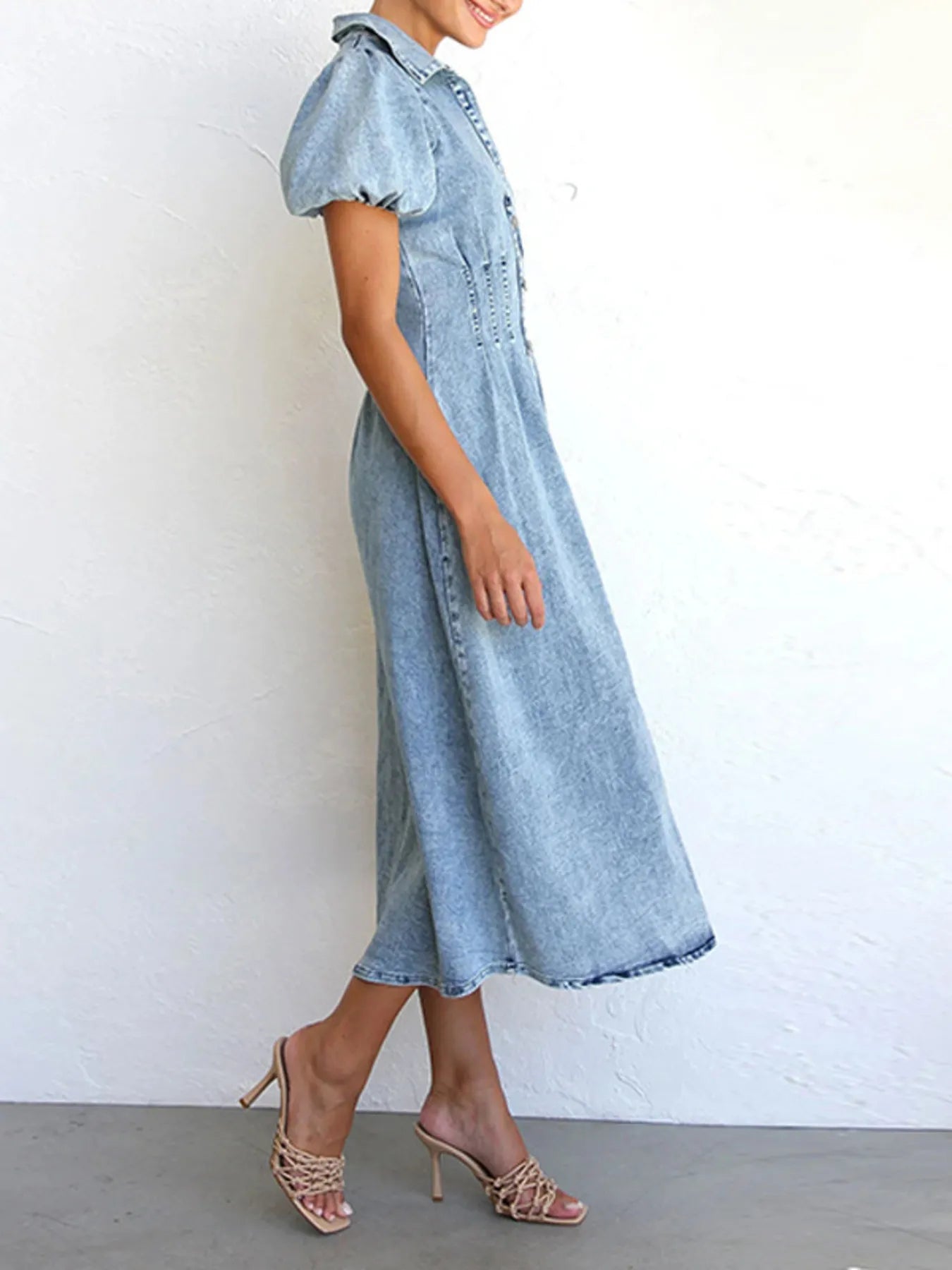 light wash puff sleeve denim midi dress with collared bodice and A line skirt model wearing heels