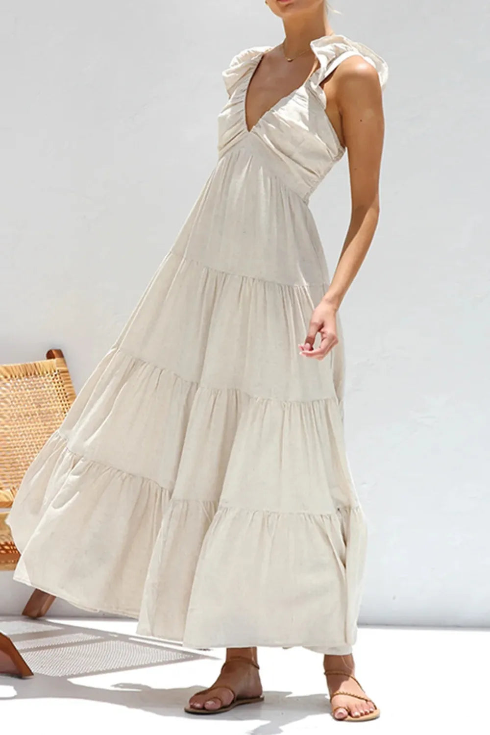 ruffled v-neck tiered dress in cream maxi length with ruffle shoulder straps and sandals