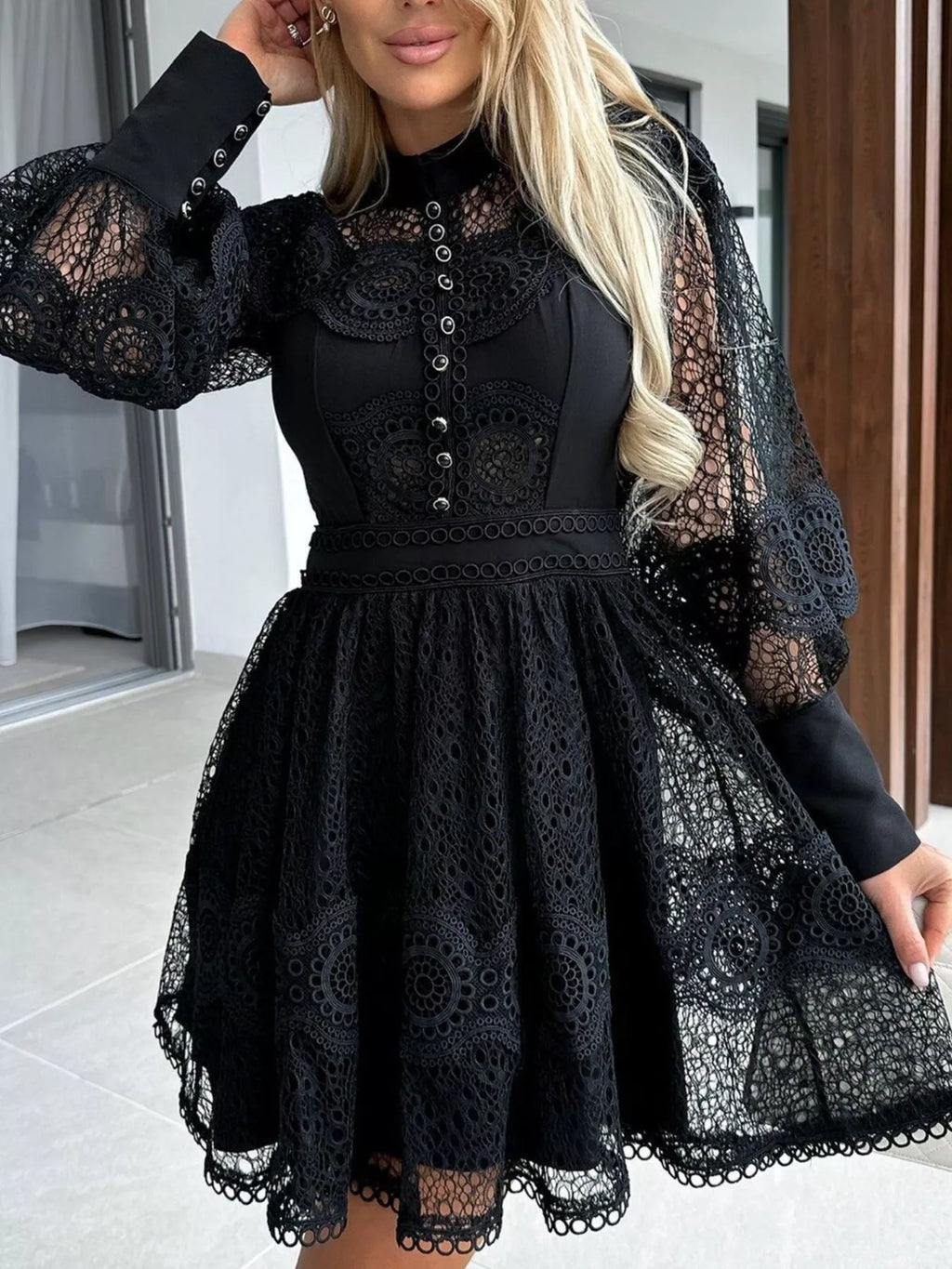 black lace lantern sleeve mini dress with high neck, button front bodice, fitted waist and scalloped hem