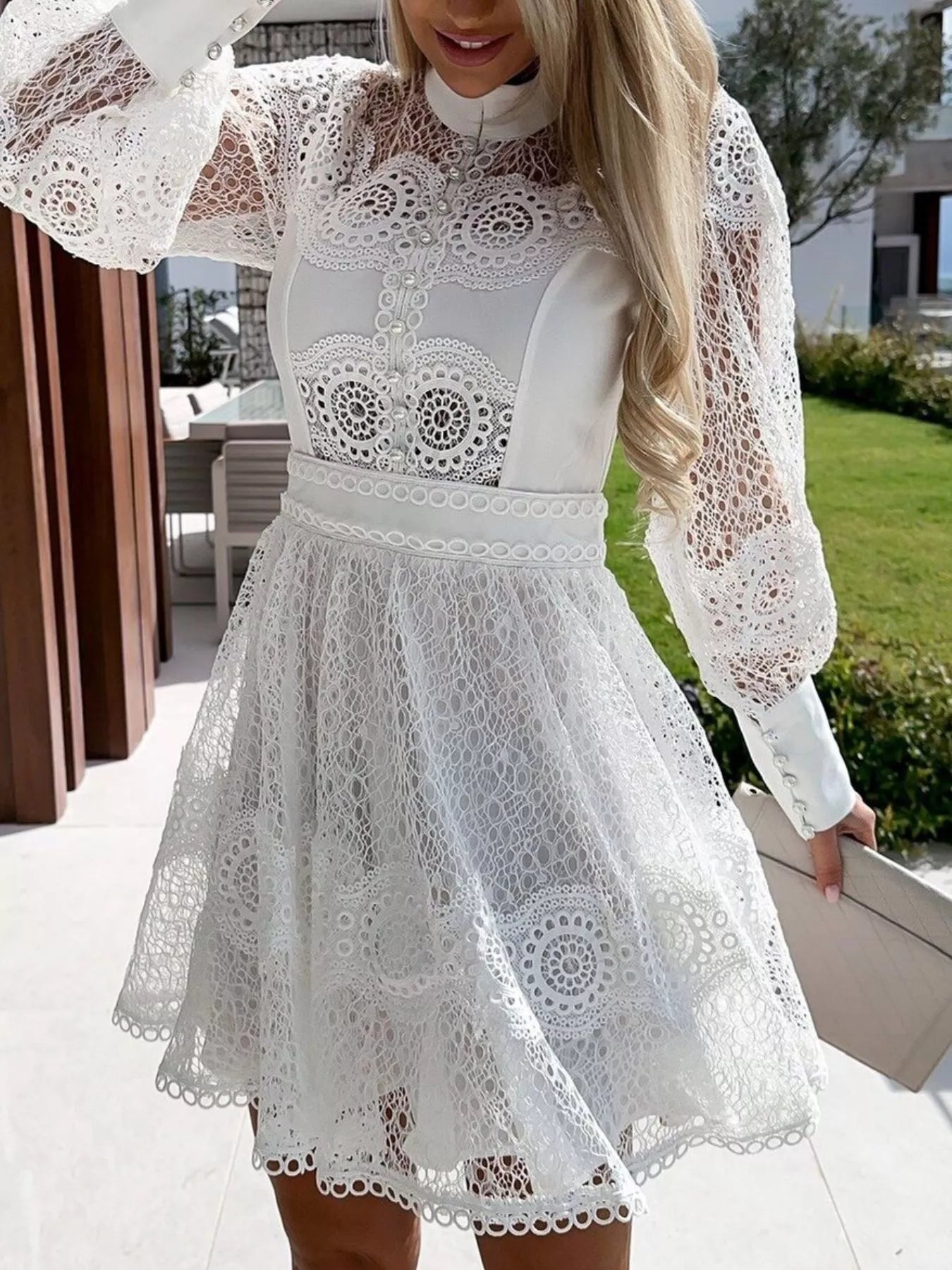 white lace lantern sleeve mini dress with high neckline fitted waist and A line lace skirt