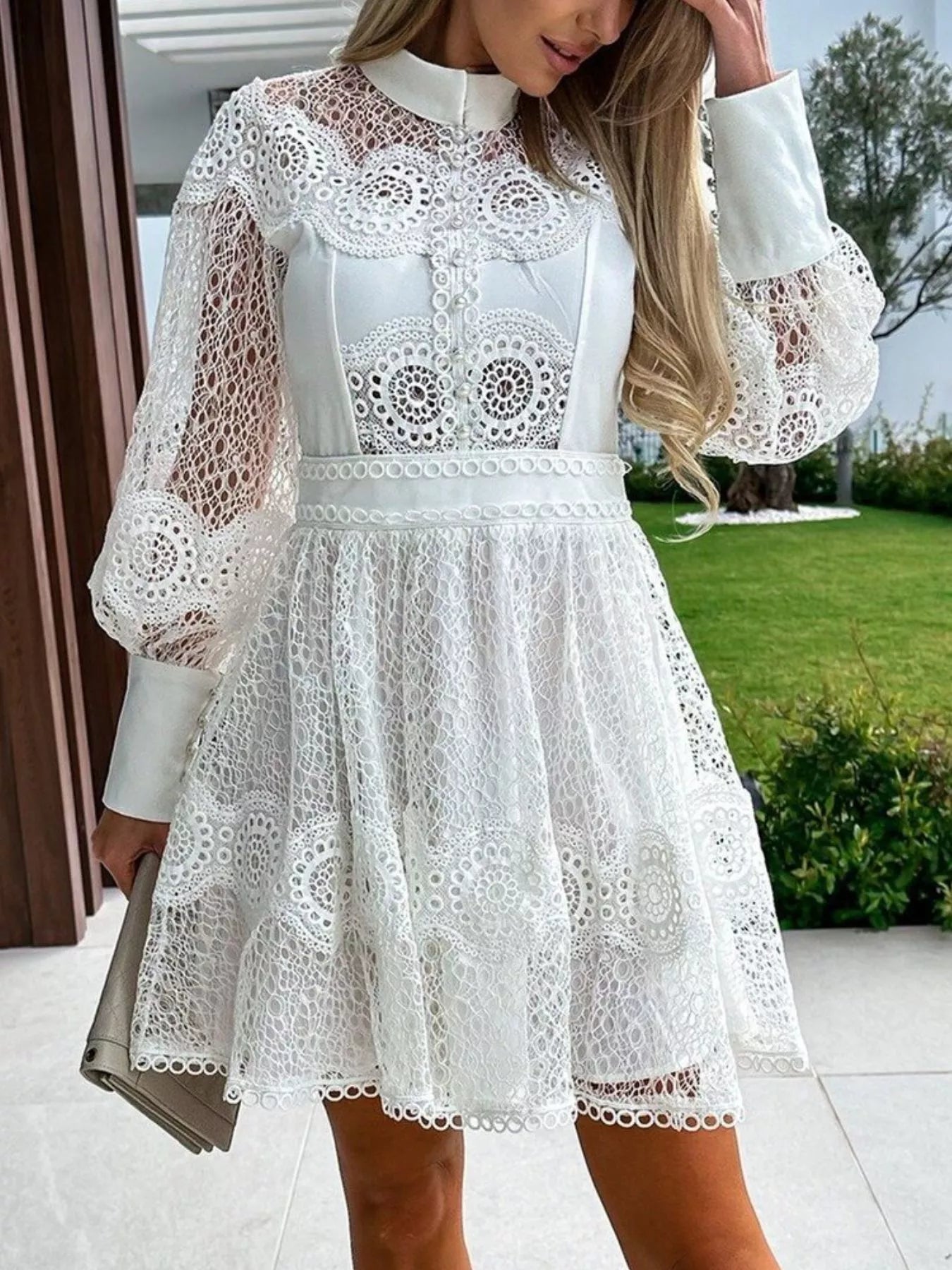 white lace lantern sleeve mini dress with high collar fitted waist and scalloped hem
