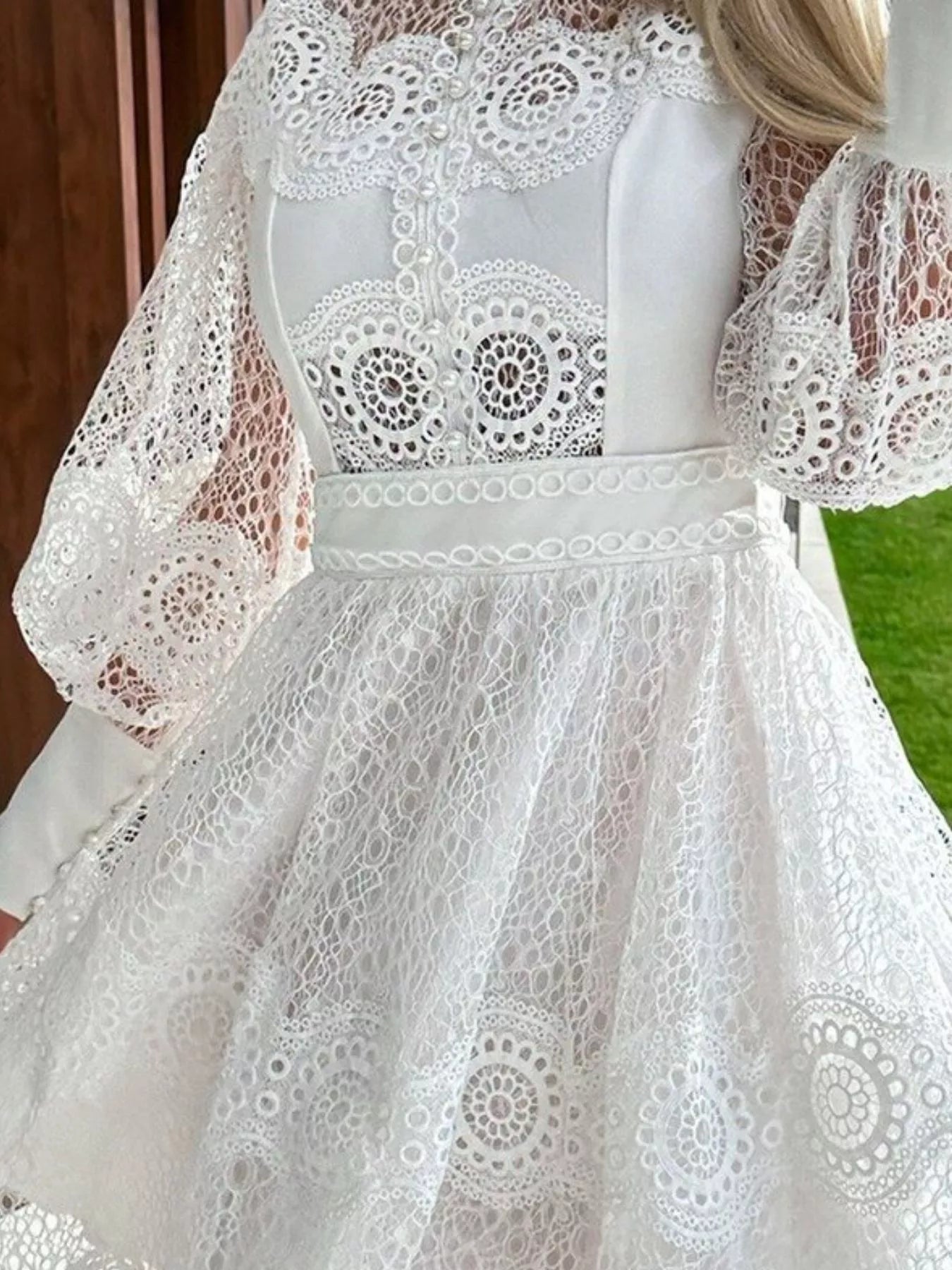 White lace lantern sleeve mini dress with scalloped high neck bodice fitted waist and flared lace skirt