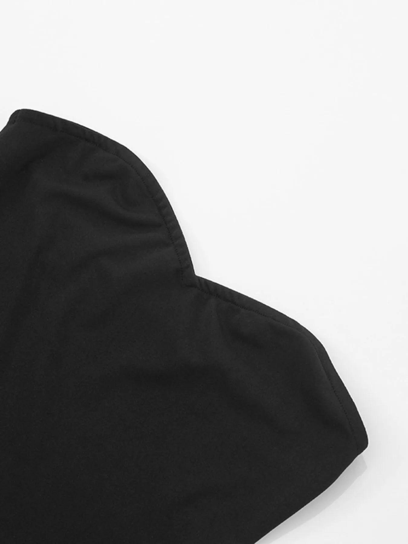 black sweetheart neck polka dot mini dress close up showing curved sweetheart neckline and bodice
