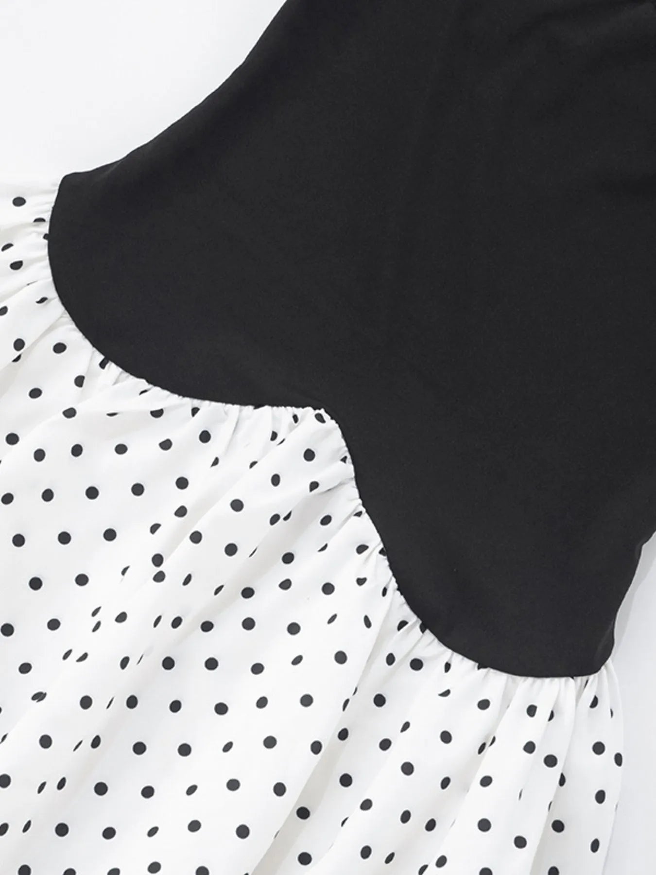 black and white sweetheart neck polka dot mini dress with contrast black bodice and gathered polka dot skirt