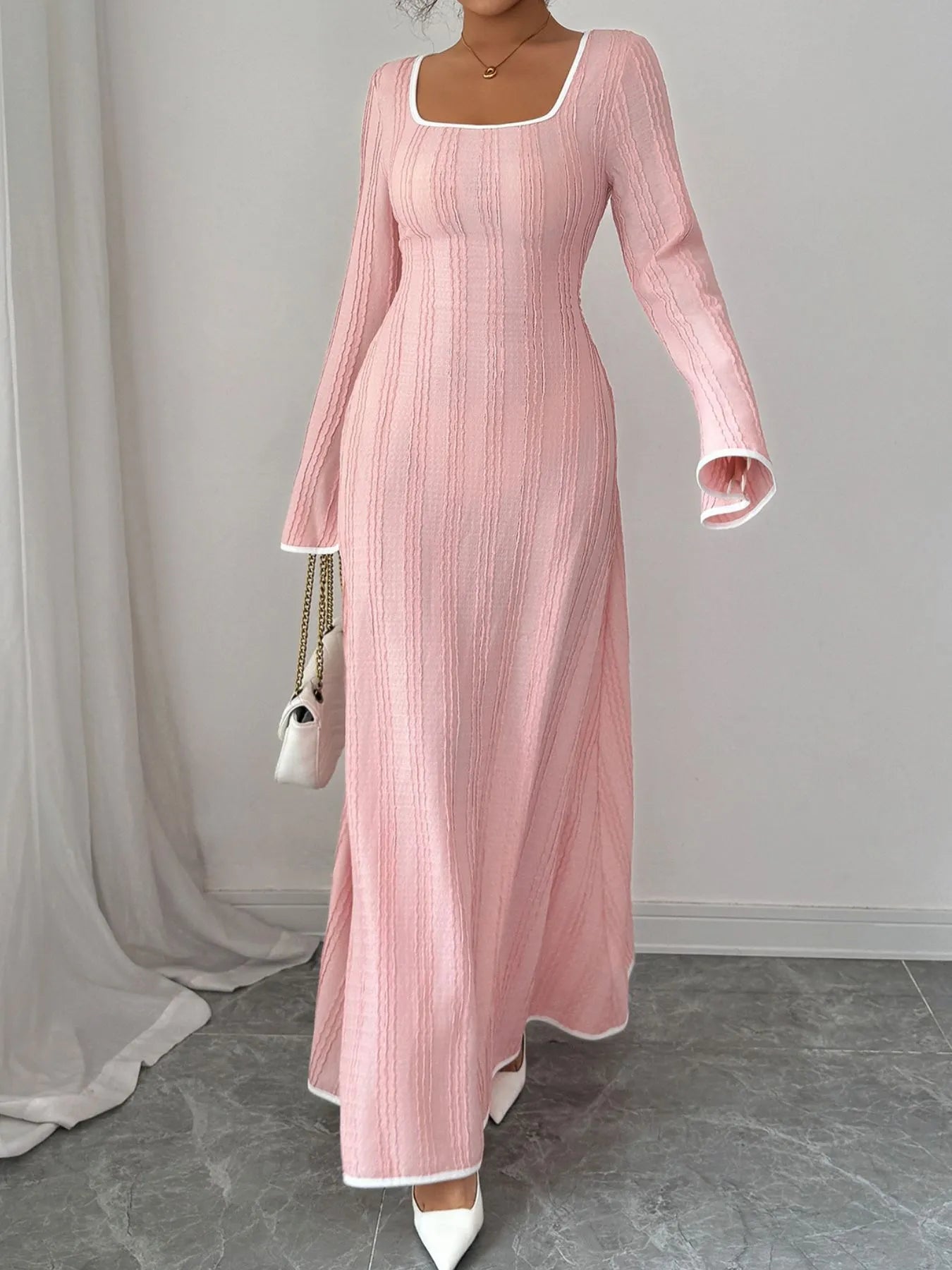 Trendsi pink textured square neck maxi dress with long sleeves white trim fitted bodice flowing skirt and white heels