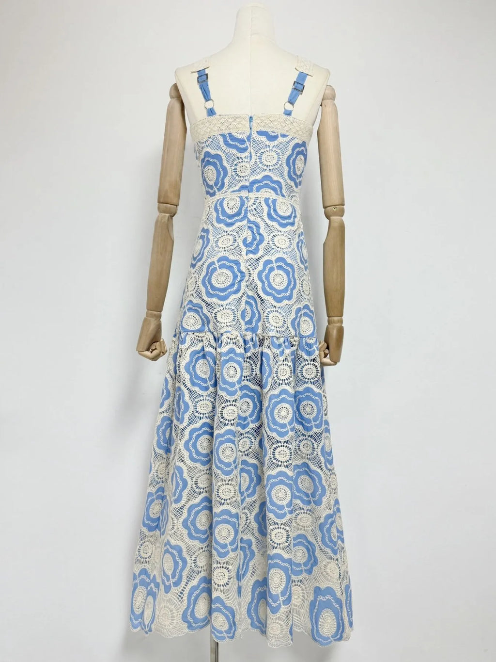 blue and white floral lace tiered midi dress back view with adjustable straps and fitted bodice