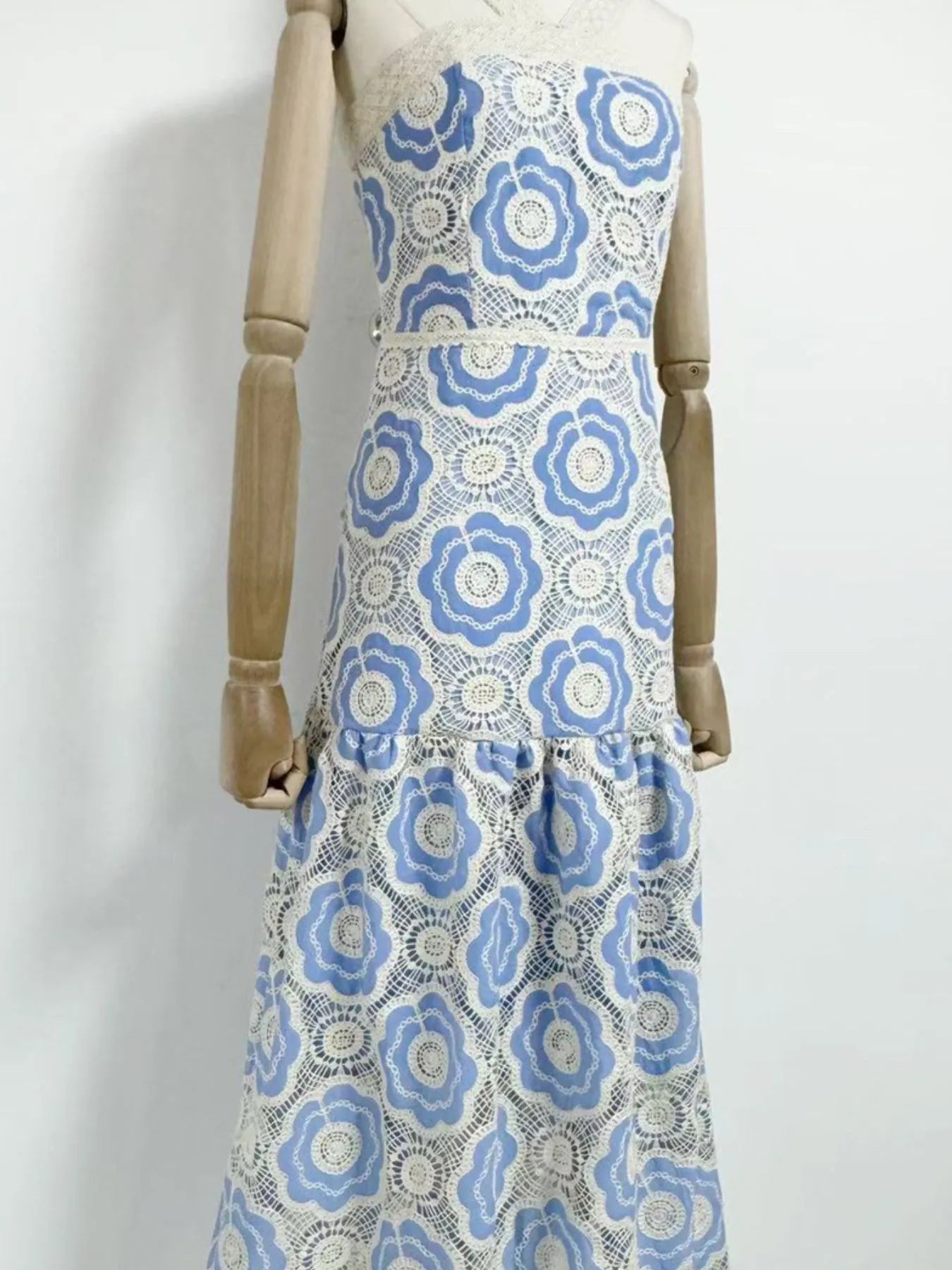 lace tiered midi dress in blue and white floral crochet lace with fitted bodice and lower ruffle tier