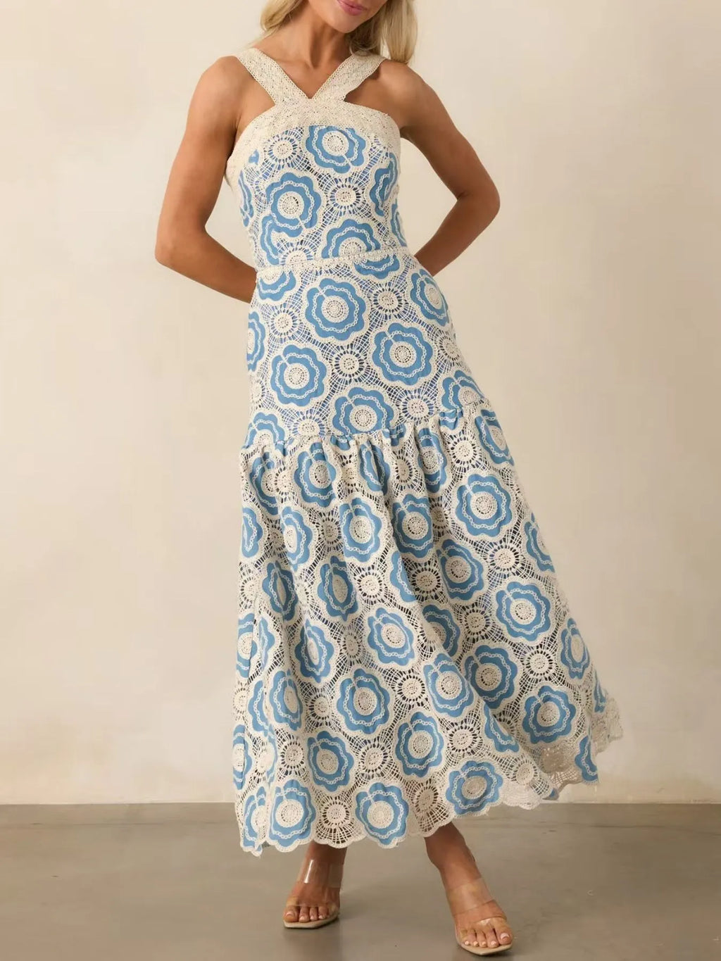 lace tiered midi dress in white and blue floral lace with crossed straps and scalloped hem