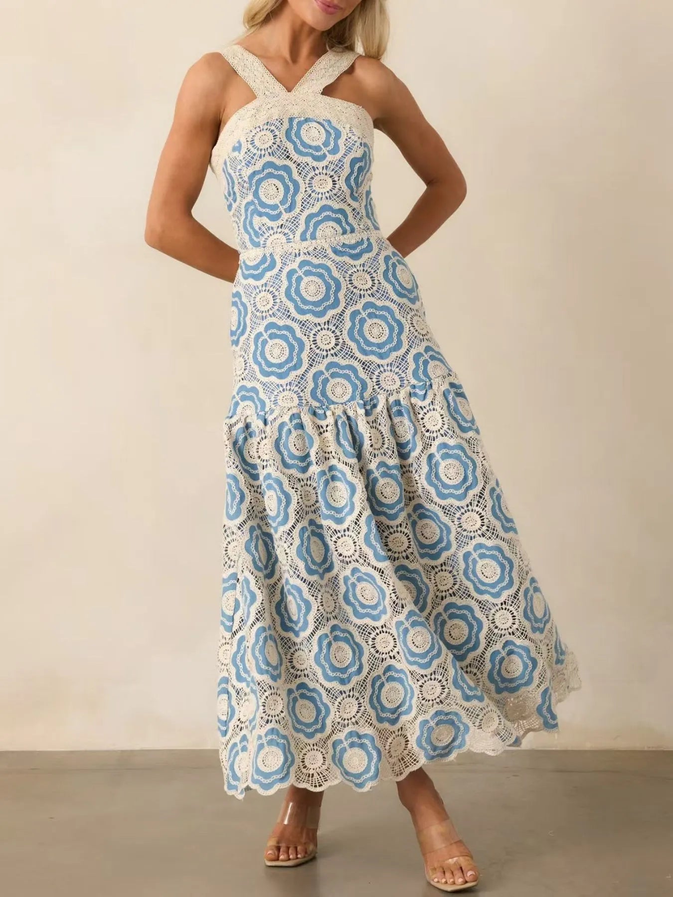 lace tiered midi dress in white and blue floral lace with crossed straps and scalloped hem