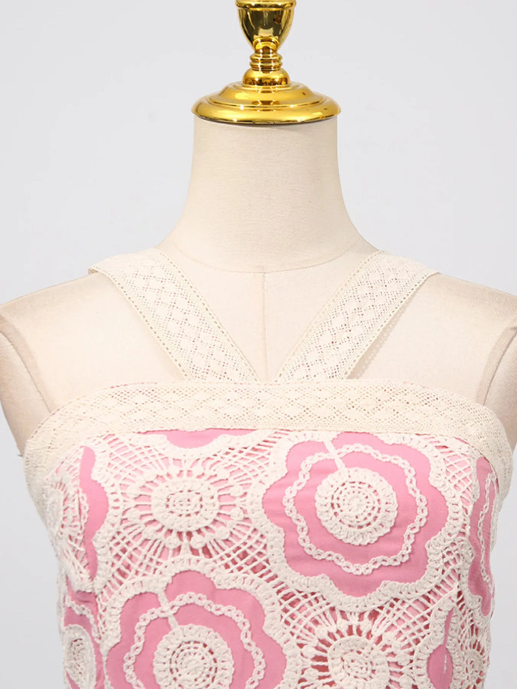 lace tiered midi dress cream crochet floral lace overlay with pink lining and crossed strap detail on mannequin