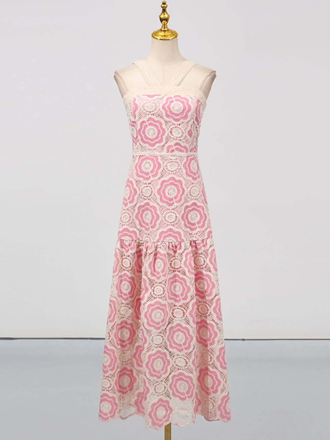 lace tiered midi dress in pink and white floral lace with sleeveless fitted bodice and flared tiers