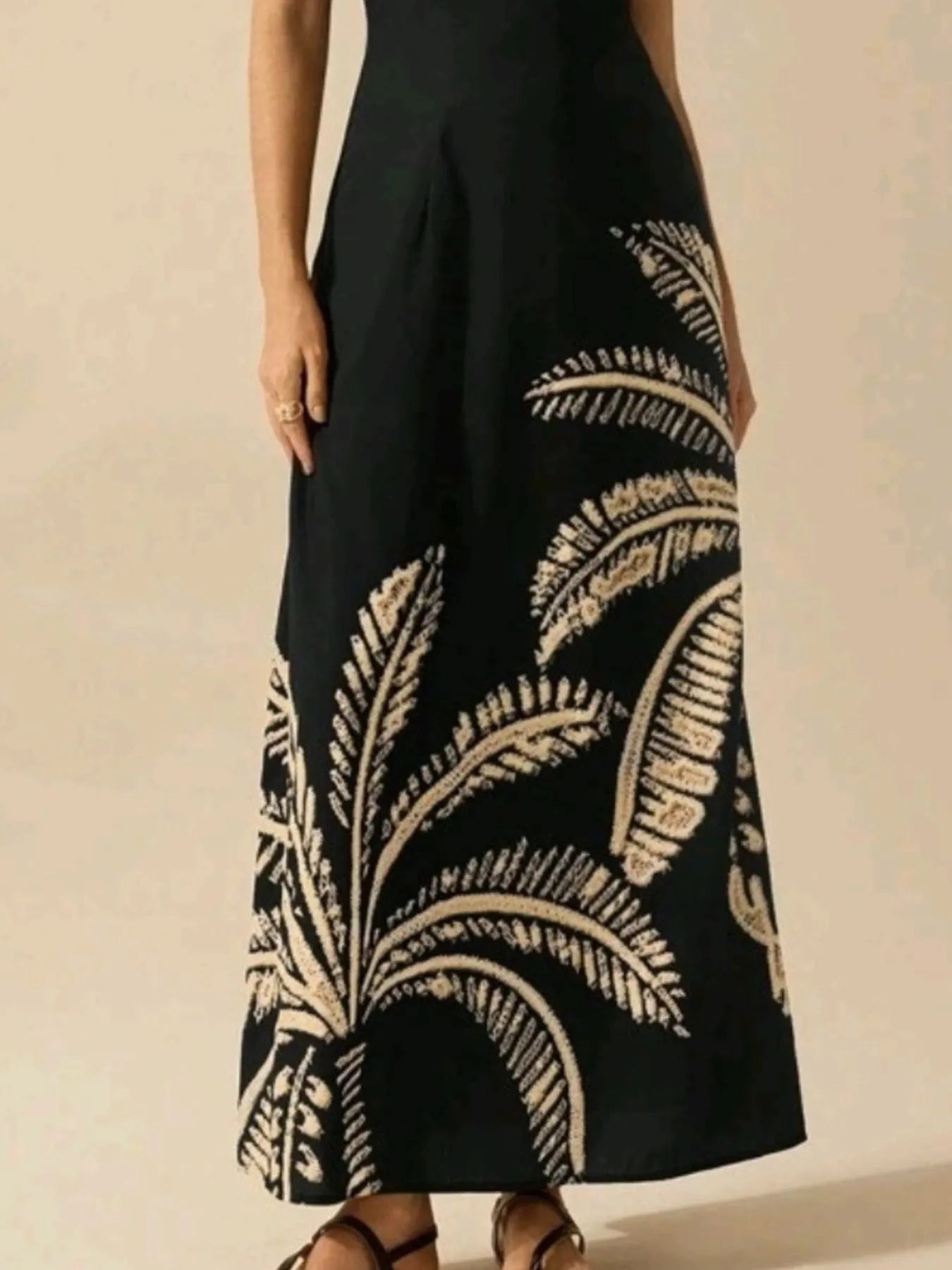 printed sleeveless maxi dress black with beige palm leaf print and fitted bodice flowing skirt