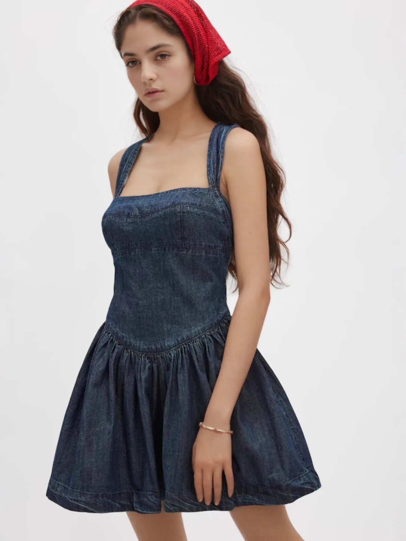 smocked denim mini dress with square neckline wide straps fitted bodice and flared skirt
