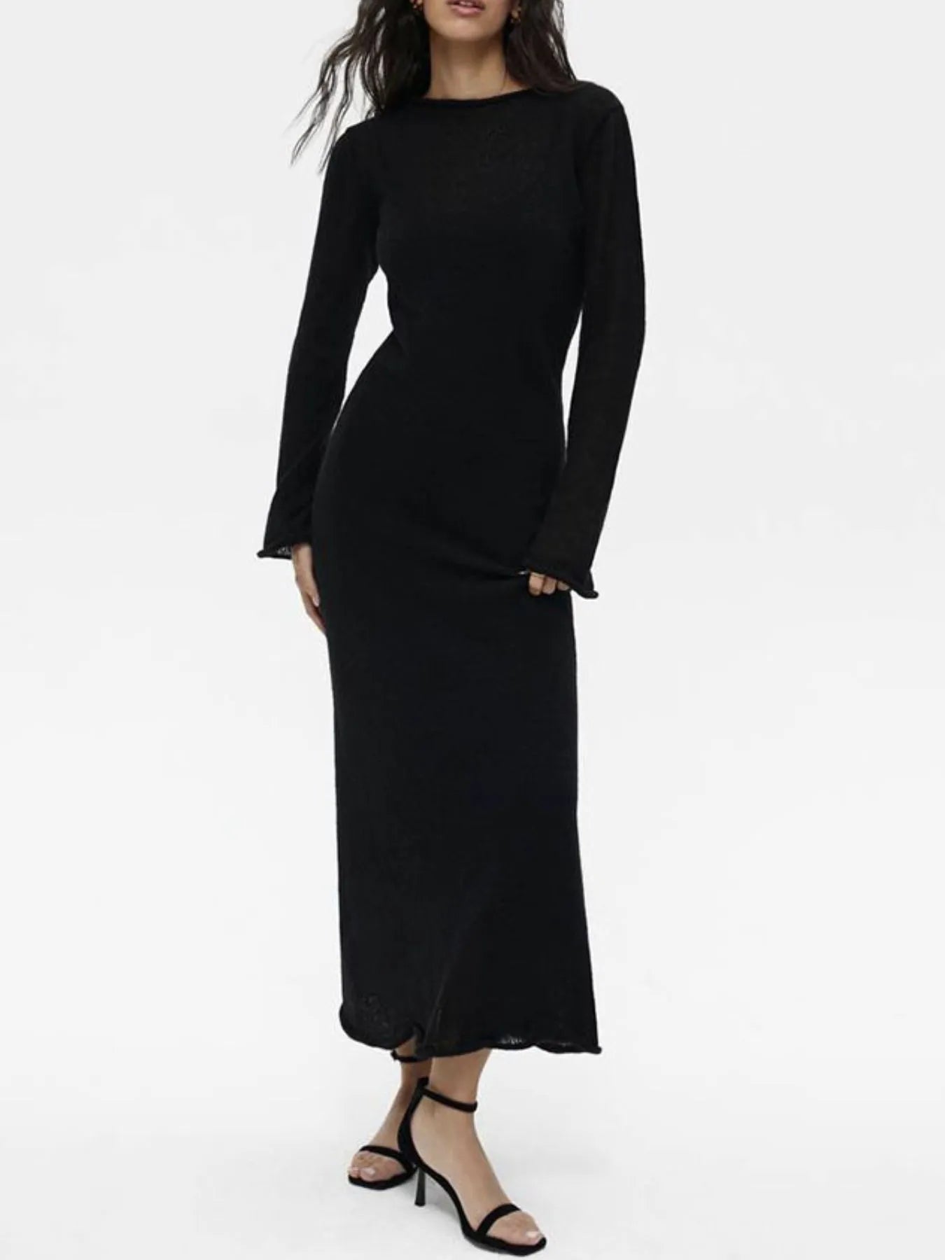 black long sleeve sweater dress styled with ribbed knit cami dress set and strappy heels