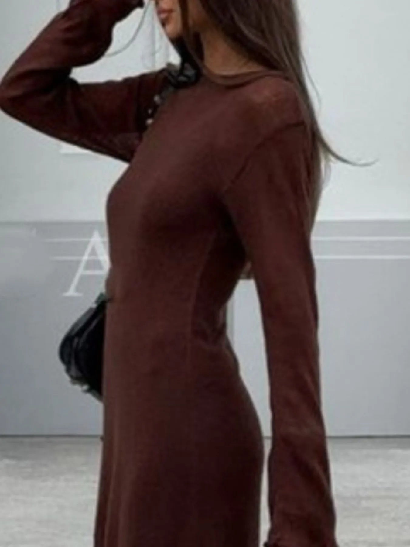 brown long sleeve fitted sweater dress side view with black shoulder bag ribbed knit cami dress set