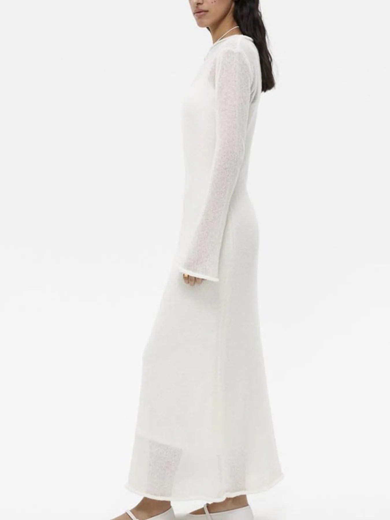 white sweater dress layered over ribbed knit cami dress set with long sheer sleeves maxi length