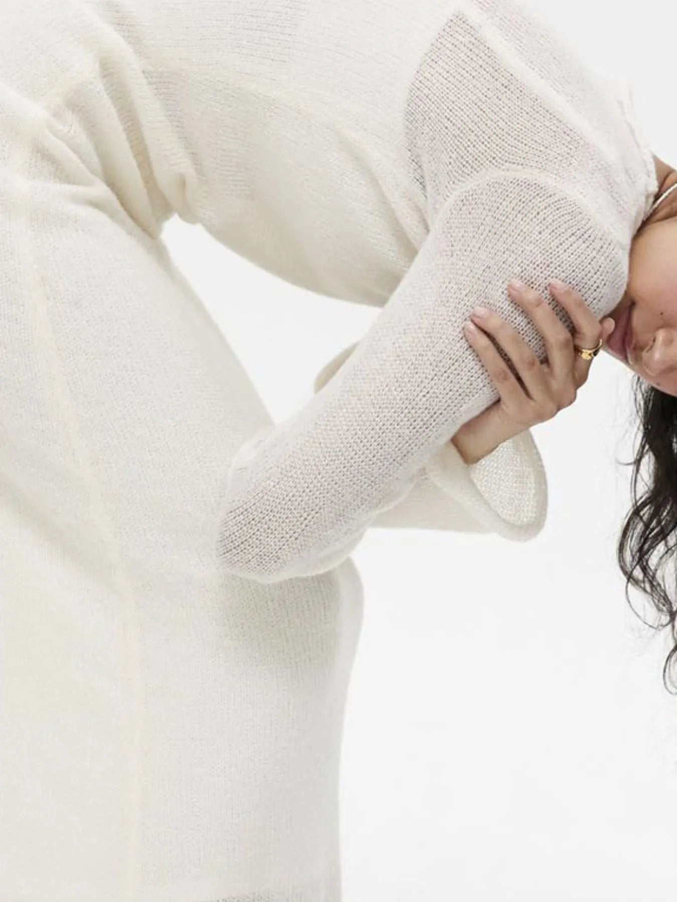 ivory sweater dress closeup showing ribbed texture long sleeves and slim fit ribbed knit cami dress set