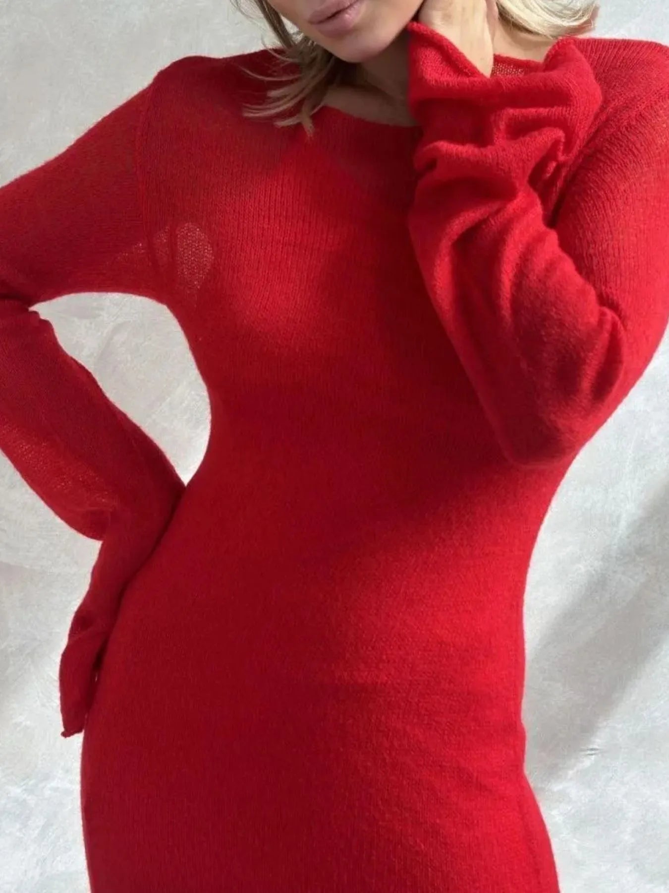 red fitted sweater dress with long sleeves close up on woman wearing ribbed knit cami dress set