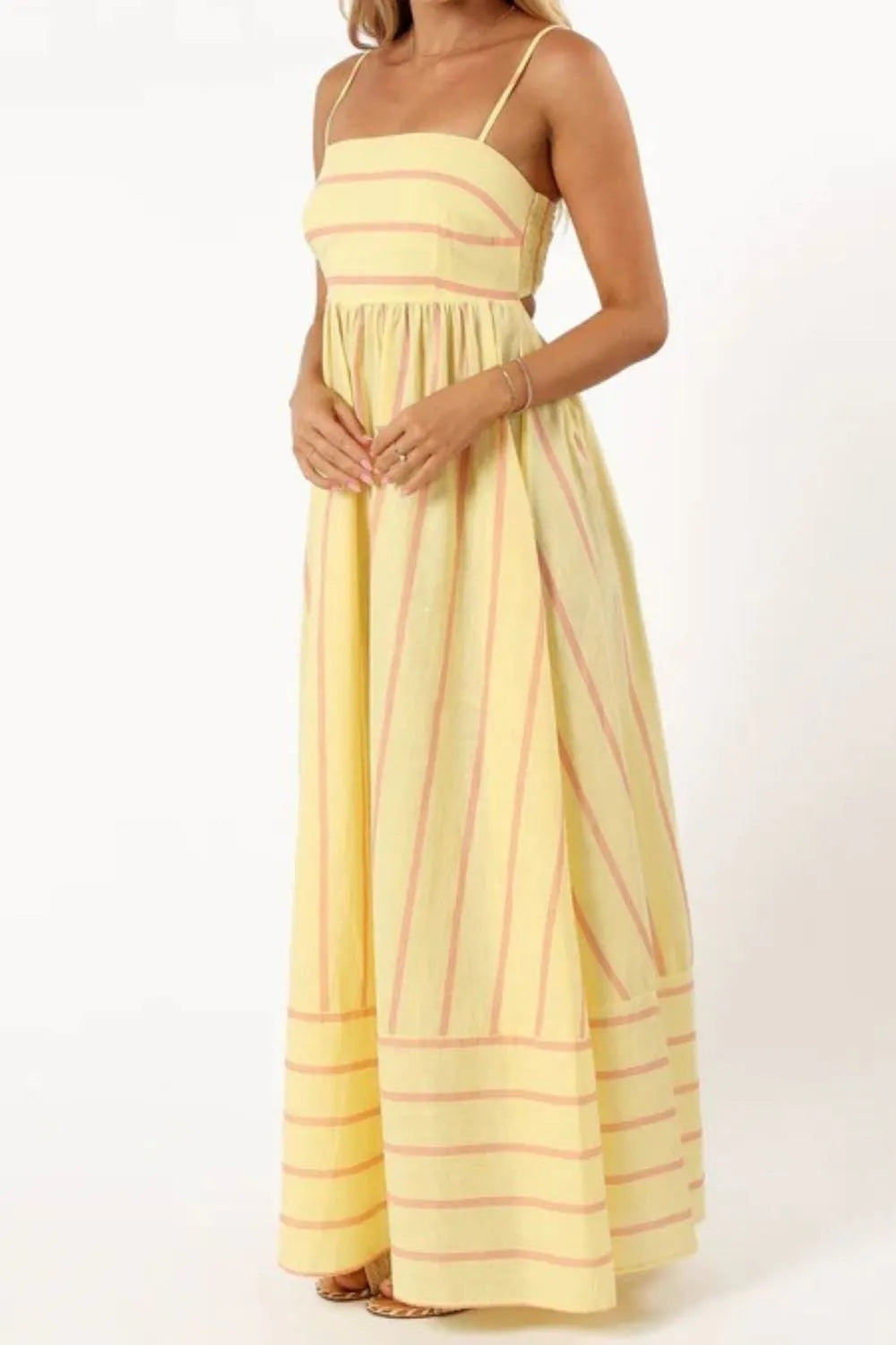 yellow striped square neck cami dress with thin straps and flowing maxi skirt