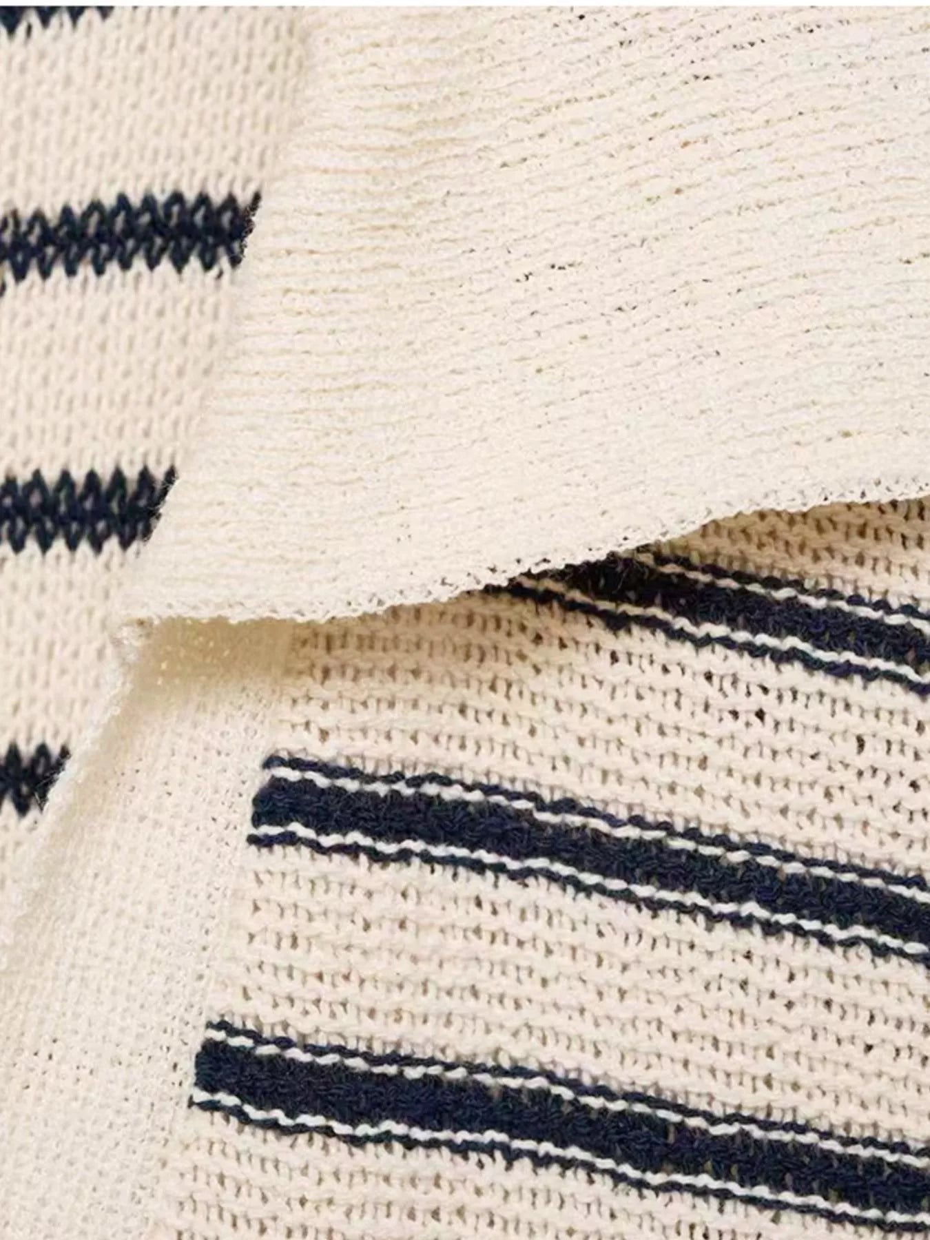 Close up textured cream knit fabric with navy horizontal stripes on a striped maxi dress for women casual beachwear